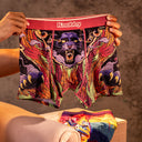 Model holding up Panther underwear design by Knobby